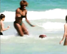 video of her in Bikini playing football in the water!