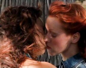 Lindy Booth kissing Tia Carrere and topless from behind in Dark Honeymoon!