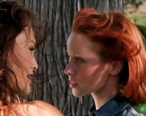 Lindy Booth kissing Tia Carrere and topless from behind in Dark Honeymoon!