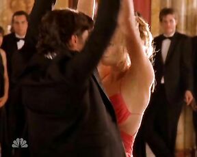 Cleavage and dancing in red dress on Chuck!