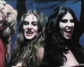 Nude with other women dancing around in As Sete Vampiras!