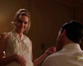 taking off her top and holding her boobs on Mad Men S03E01!