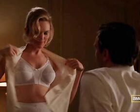 taking off her top and holding her boobs on Mad Men S03E01!