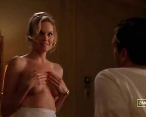 taking off her top and holding her boobs on Mad Men S03E01!