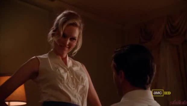 taking off her top and holding her boobs on Mad Men S03E01!