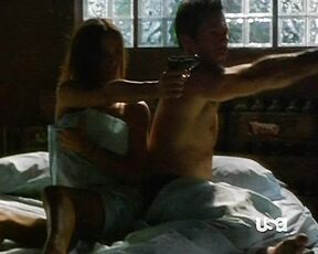 Naked on a bed but kinda covering in Burn Notice!