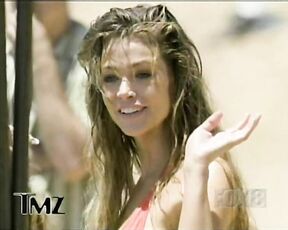 Paparazzi video footage of her red Bikini romp on the beach!