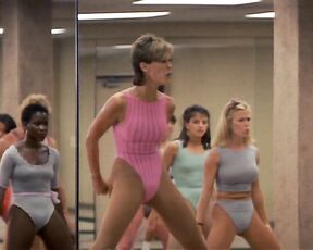 Jamie Lee Curtis and Marilu Henner in spandex with pokers in Perfect!