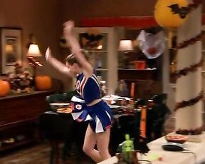 in cheerleader outfit on According to Jim!