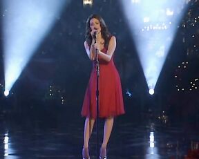 singing in a red dress on Grove Christmas!