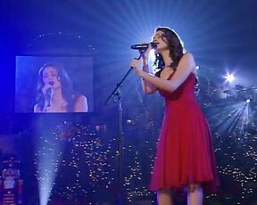 singing in a red dress on Grove Christmas!