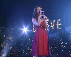 singing in a red dress on Grove Christmas!