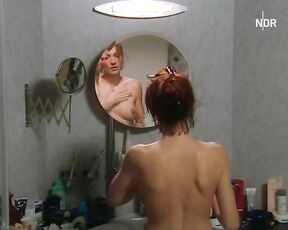 Naked in front of mirror from In aller Freundschaft: Alptraume!